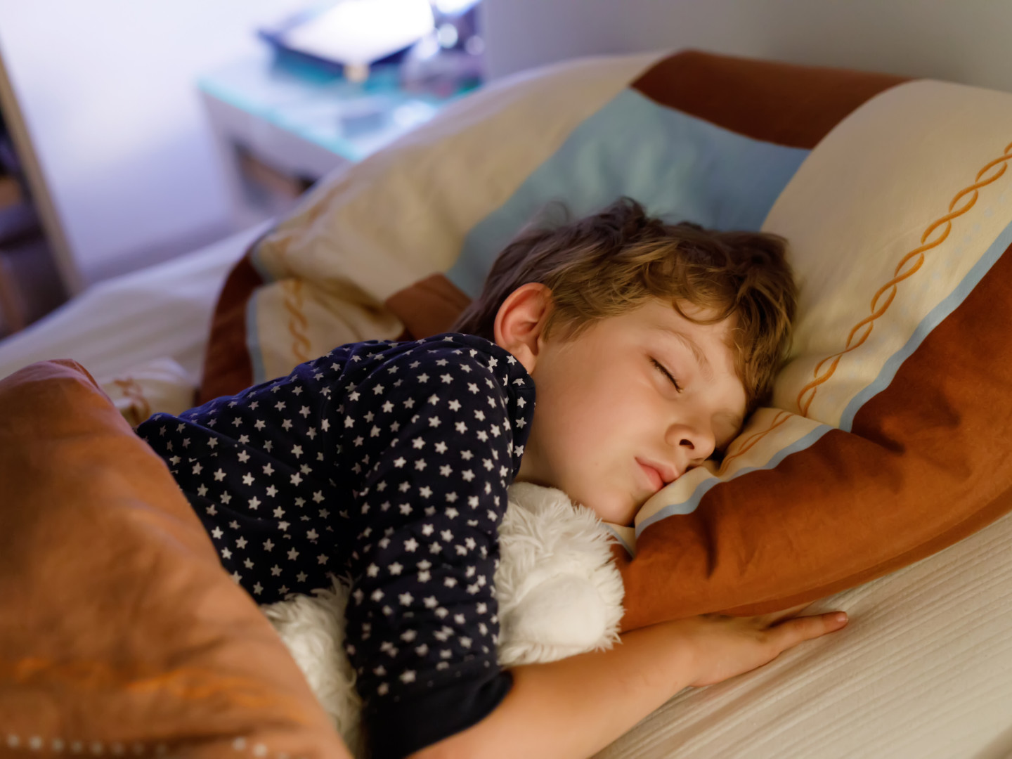 Child sleeping in bed getting good sleep