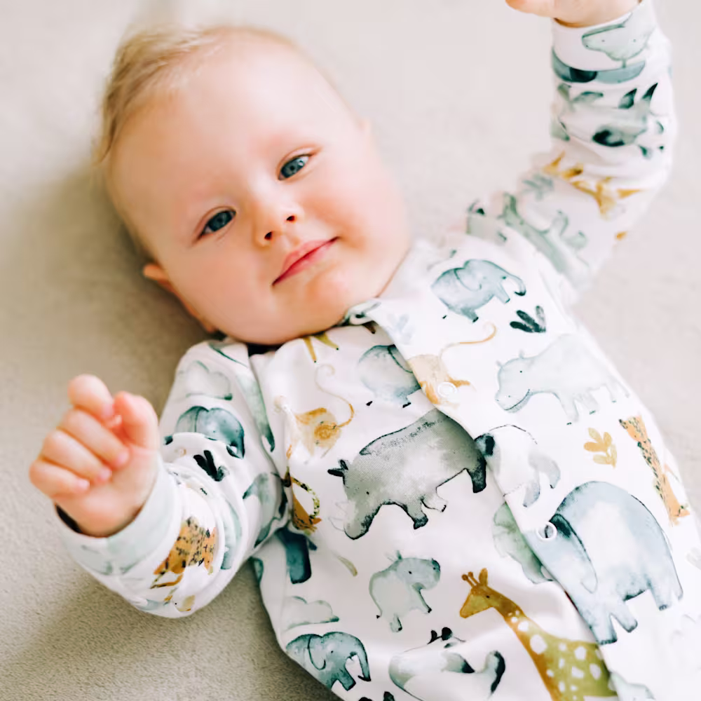 Baby in crib in a sleeper