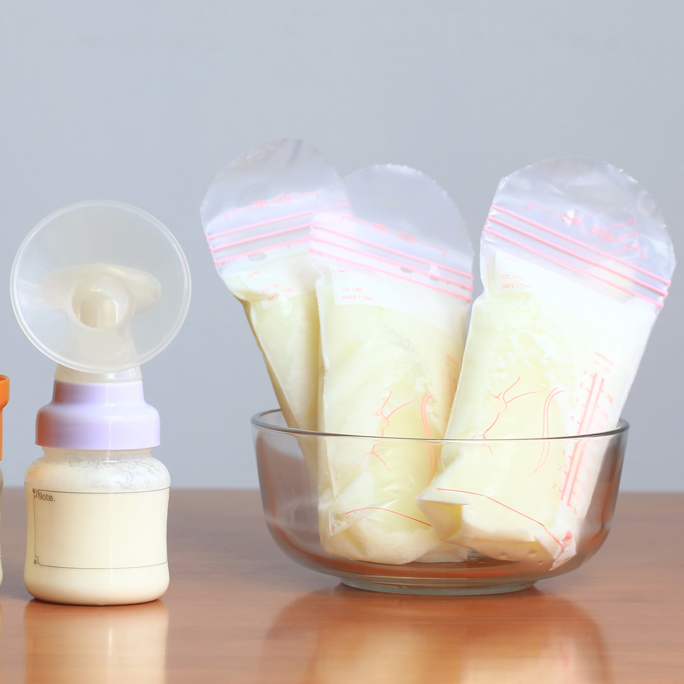 Bags of frozen breast milk and bottles