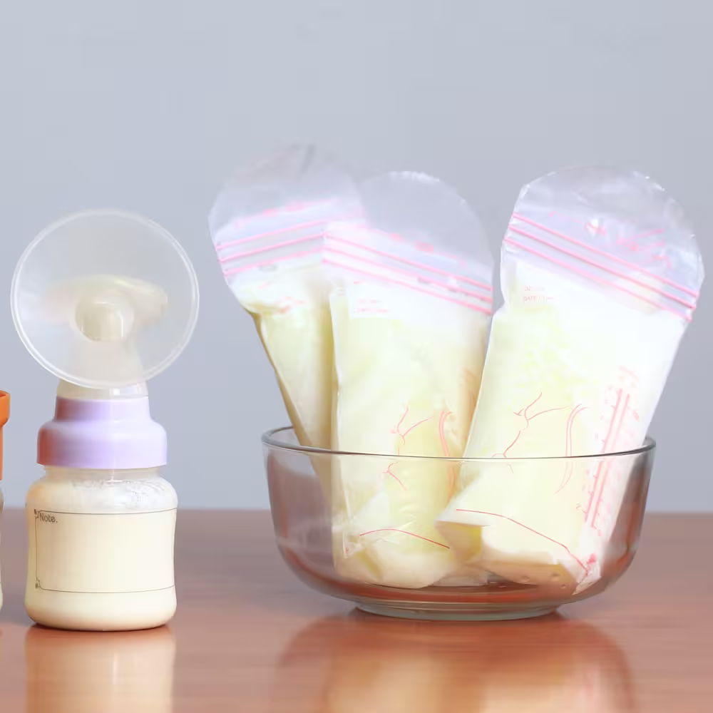 Bags of frozen breast milk and bottles