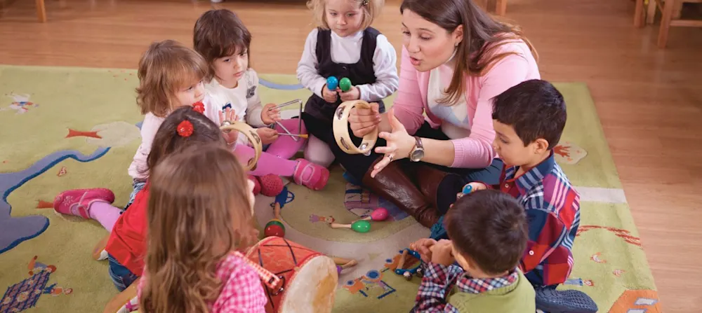A group of little children with musical instruments.