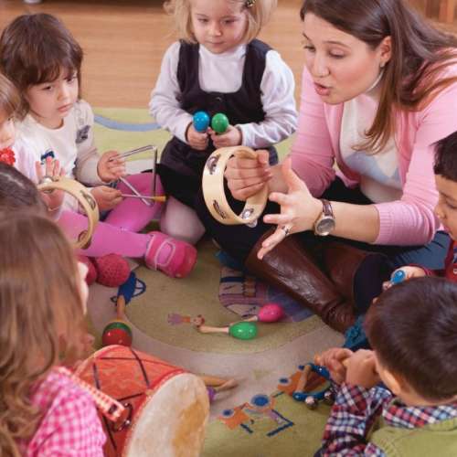 A group of little children with musical instruments.