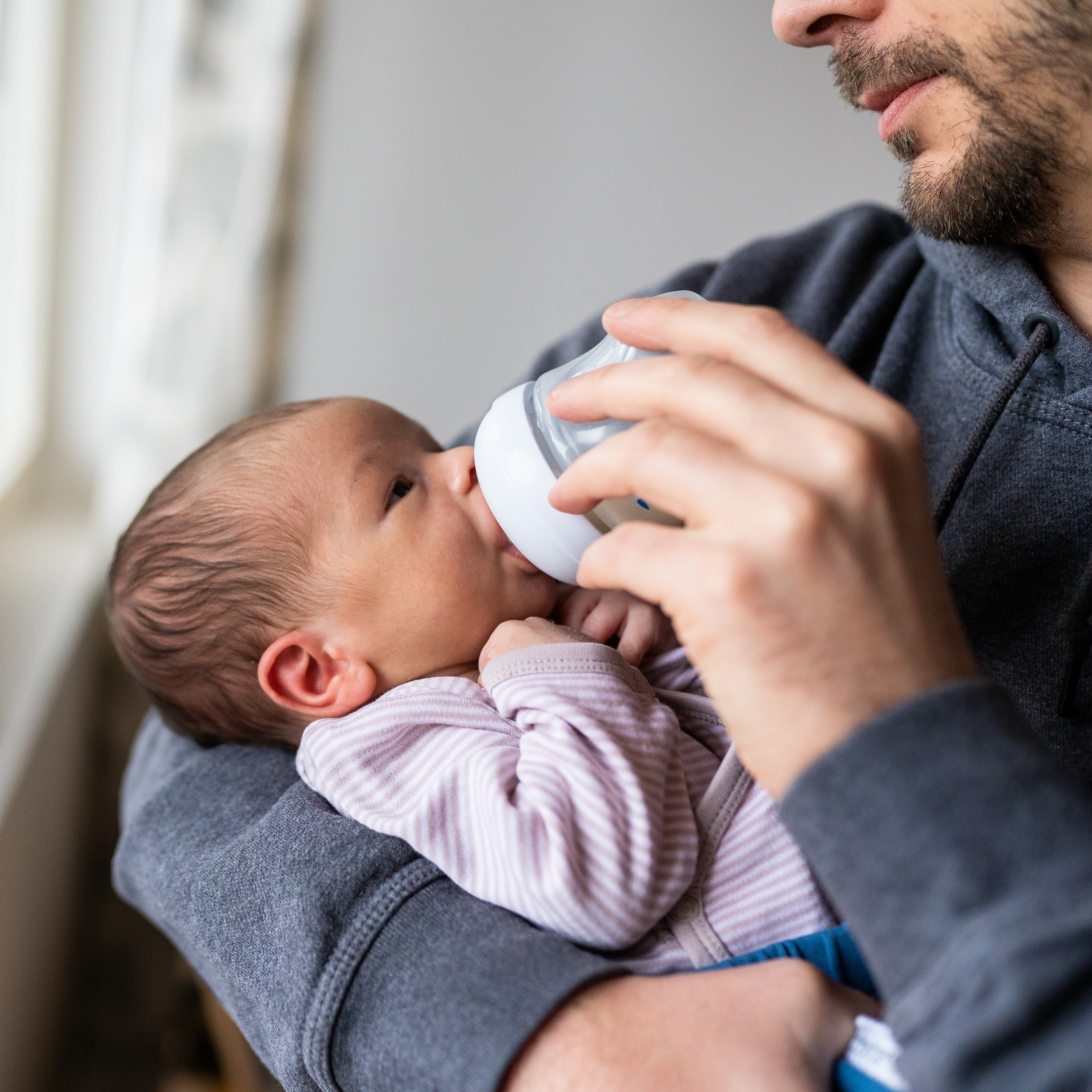Newborn baby bottle feeding.