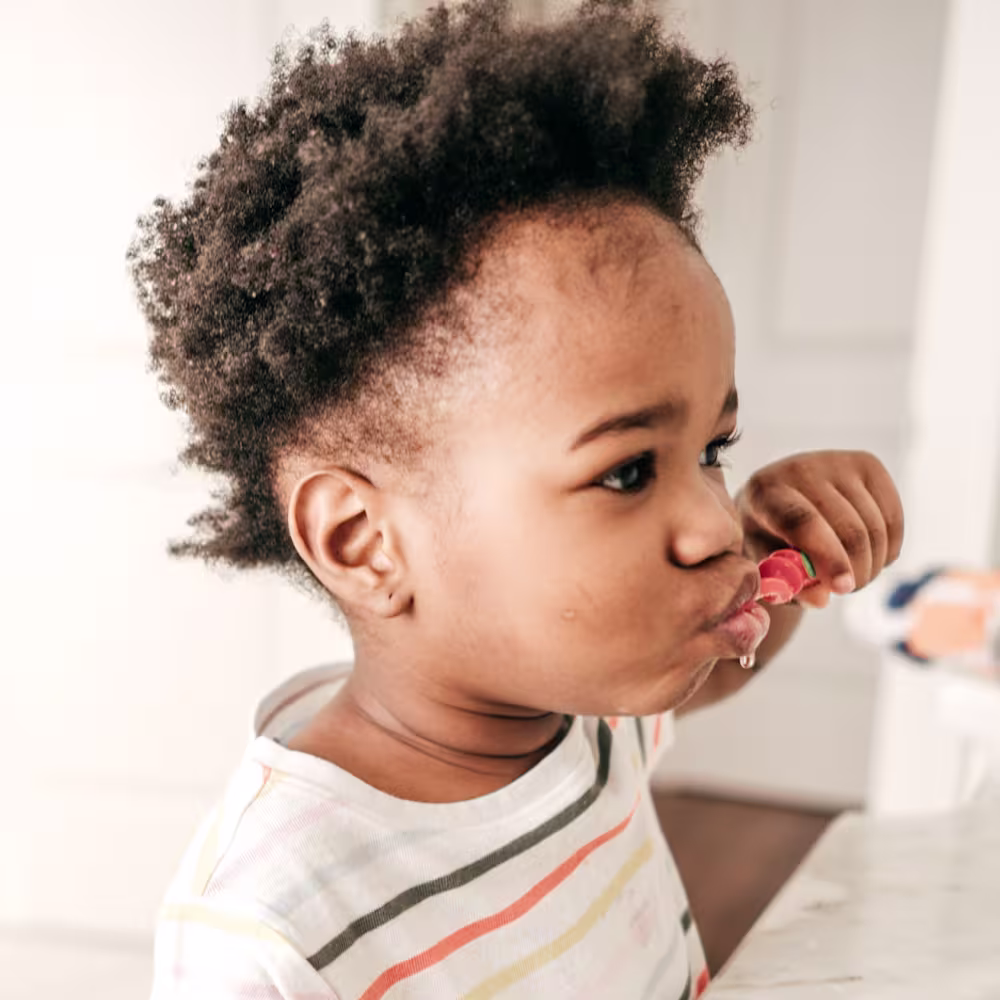 Toddler brushing teeth before bed