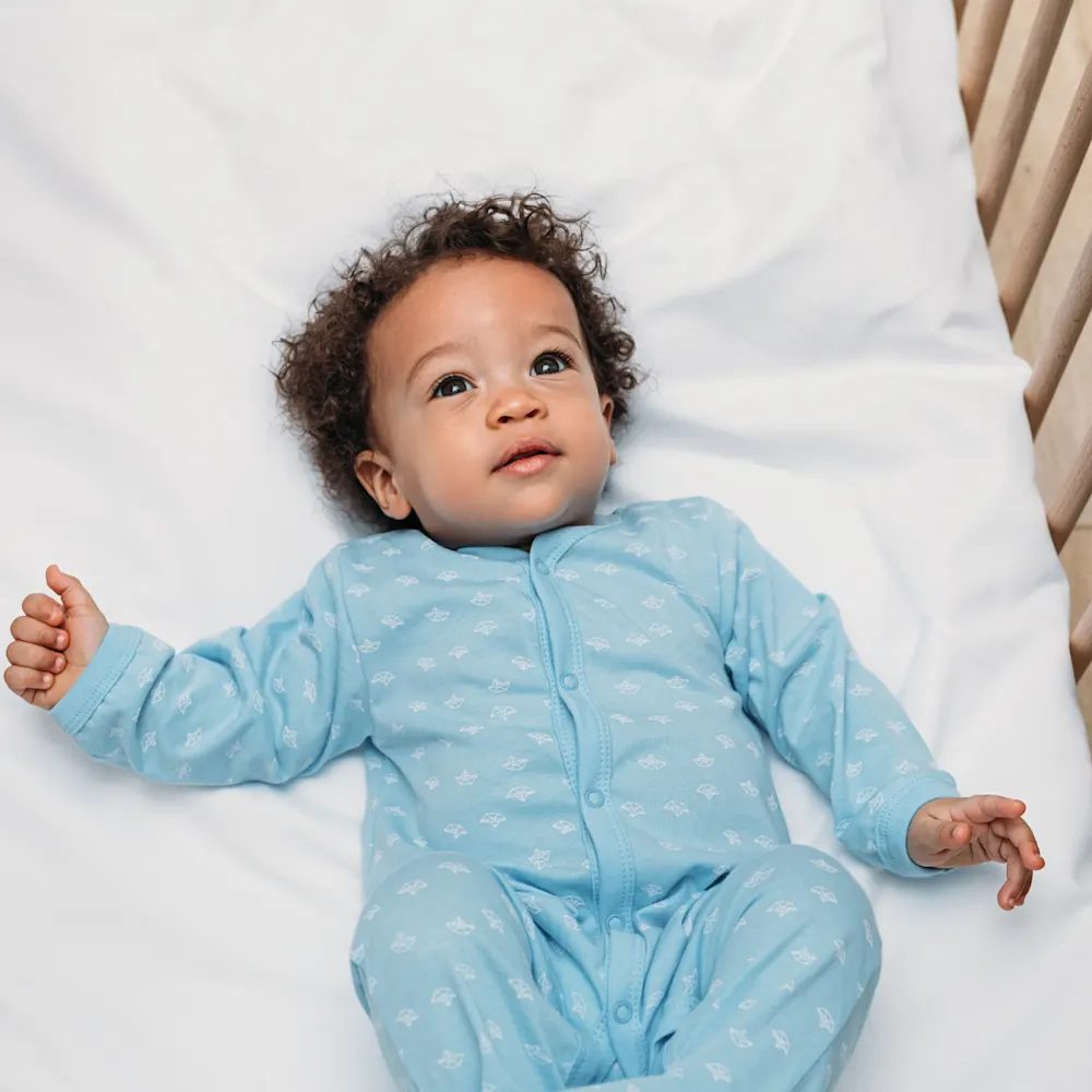 Baby awake in crib.