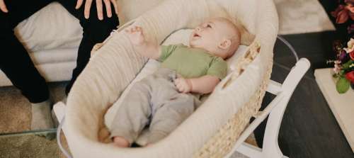 A baby in a bassinet.