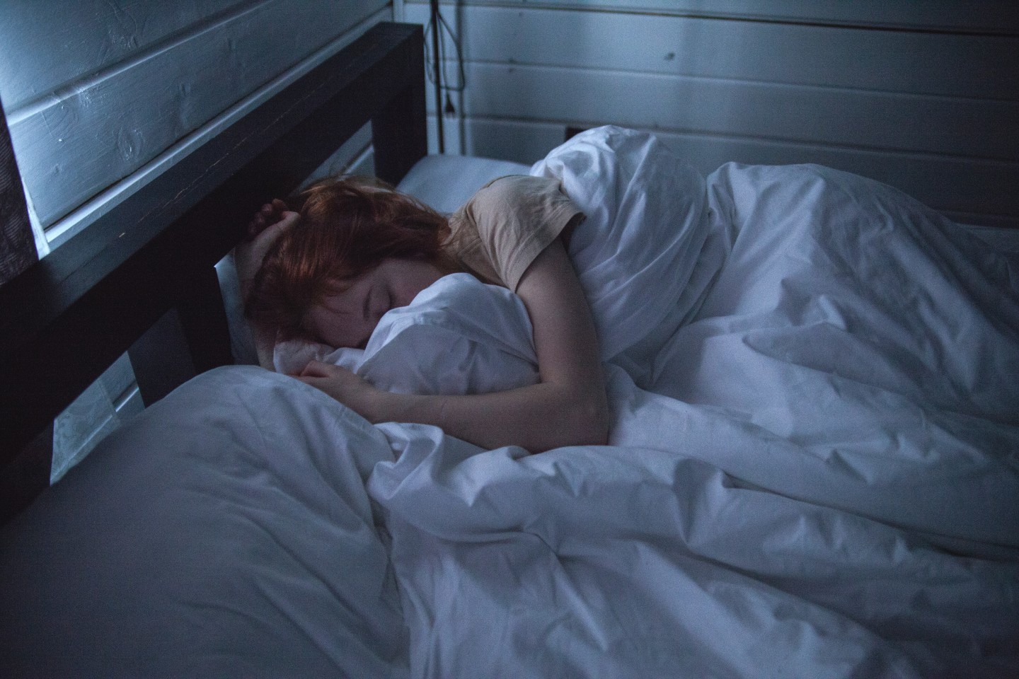 Adult woman sleeping in bed