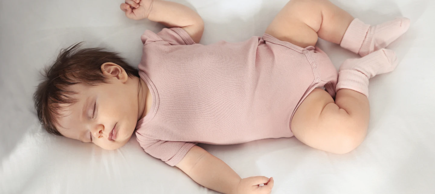 Baby napping after a feeding | Huckleberry