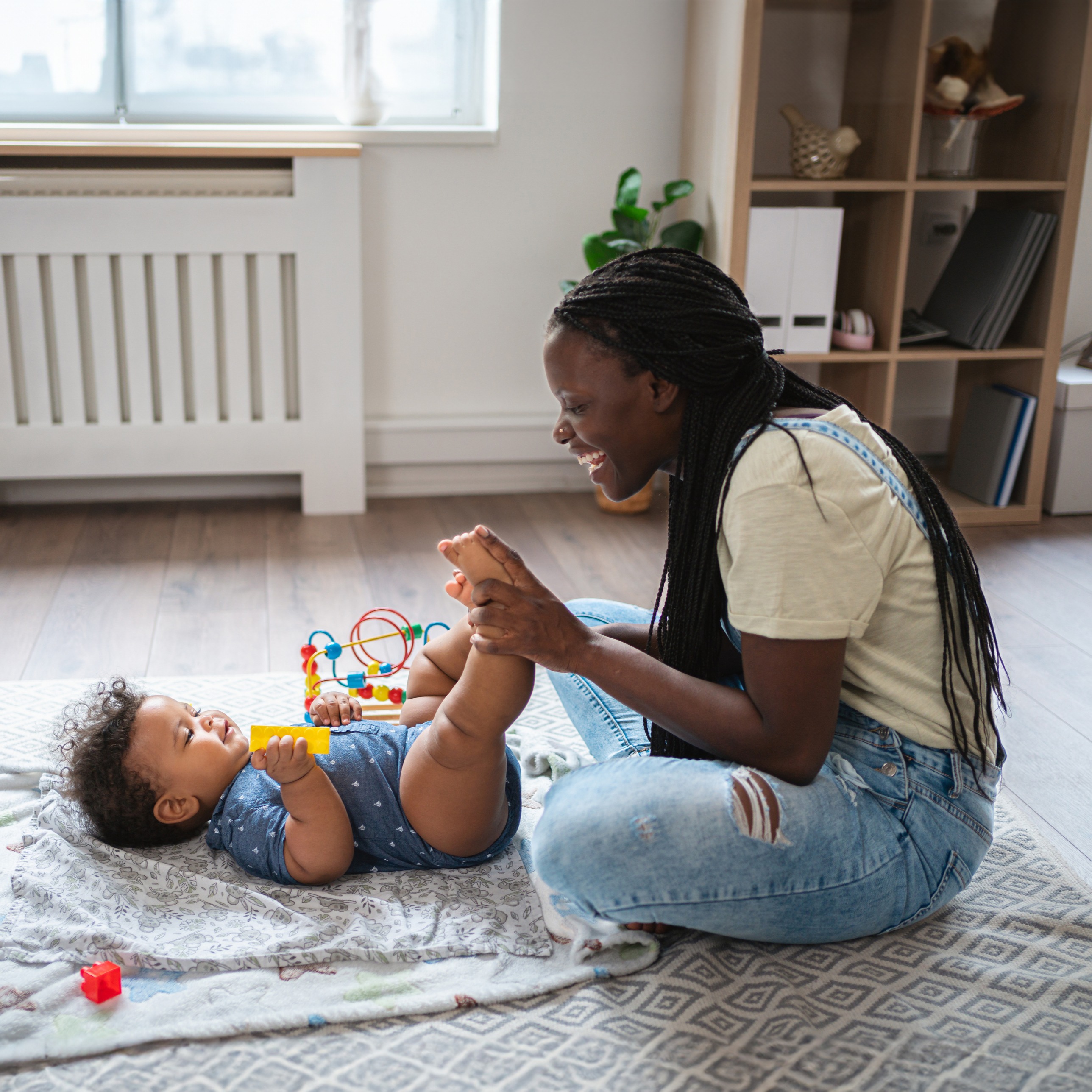 Mother massaging her child's feet