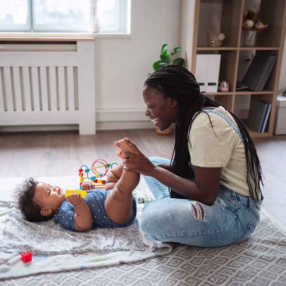 Mother massaging her child's feet