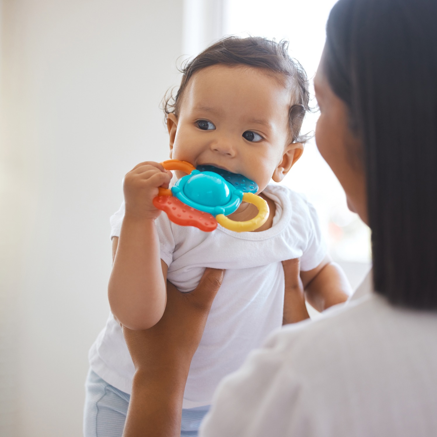 Mother and teething baby