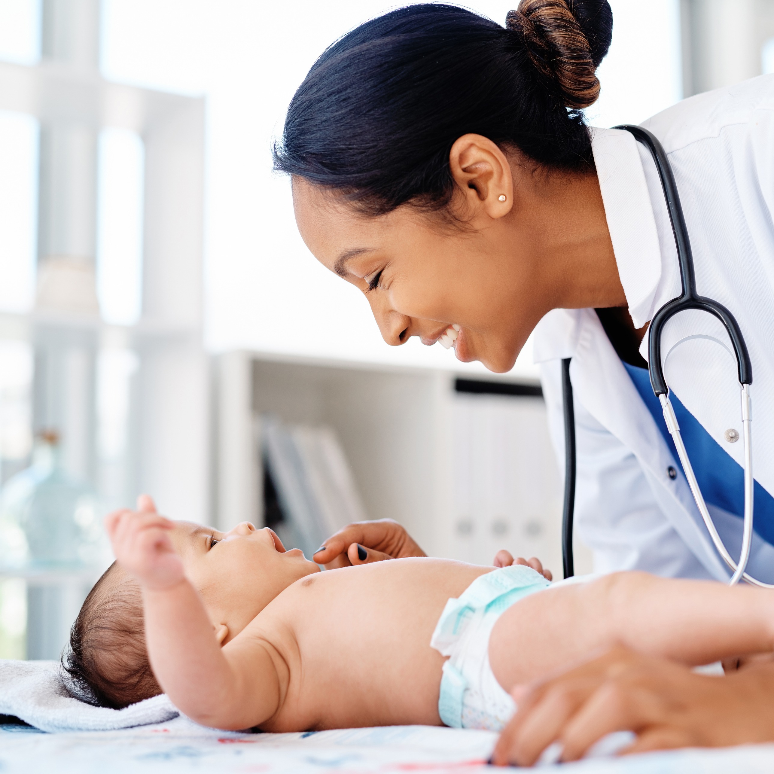 Pediatrician with newborn baby