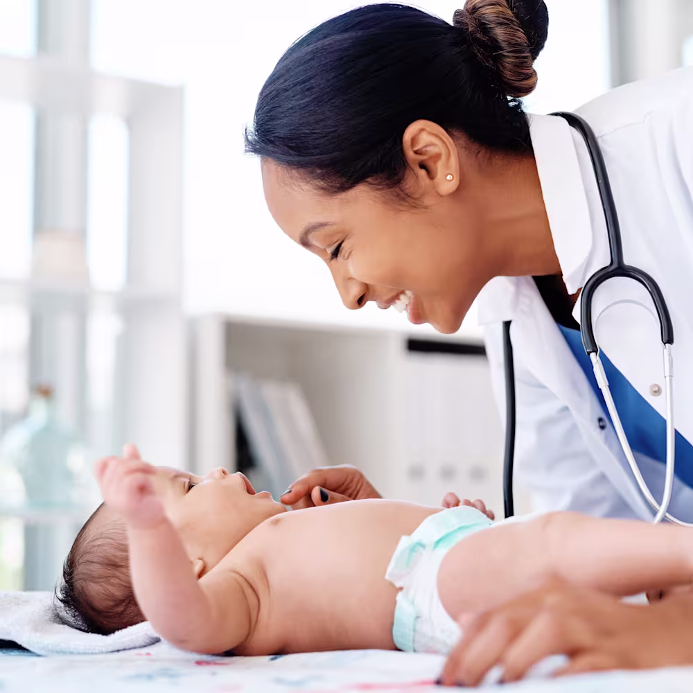 Pediatrician with newborn baby