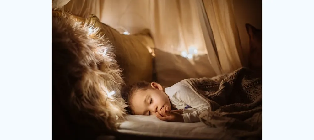 Toddler asleep in bed