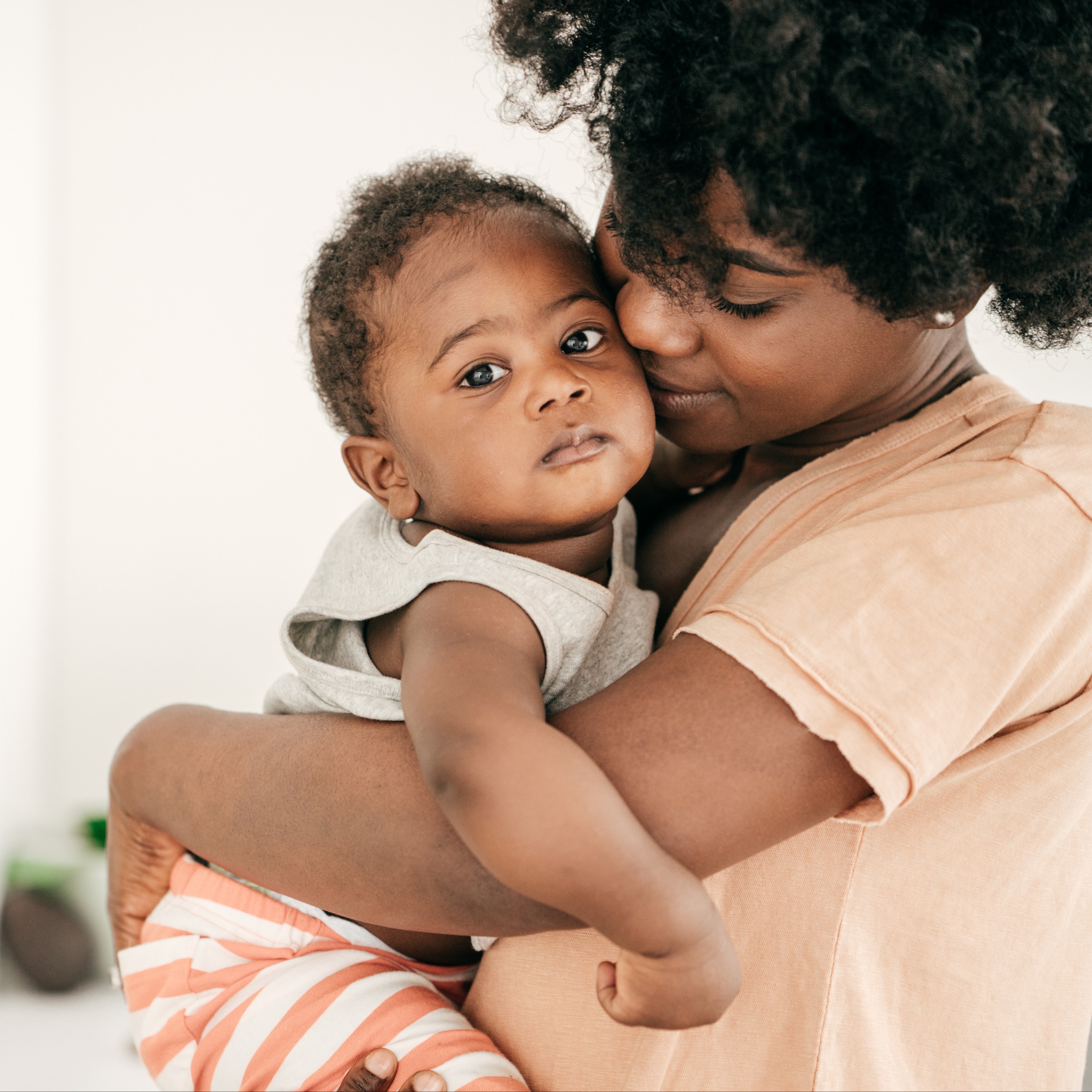 Baby with a stuffy nose snuggling mom