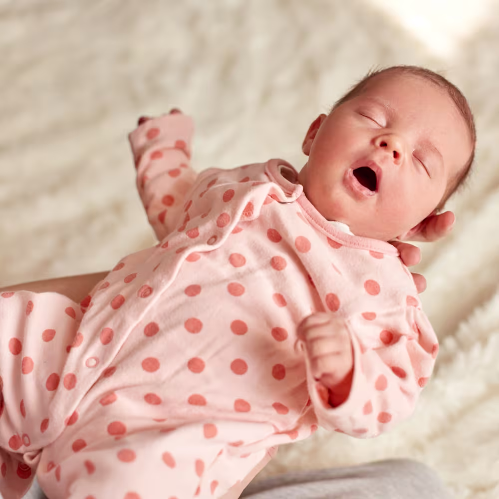Baby sleeping with open mouth