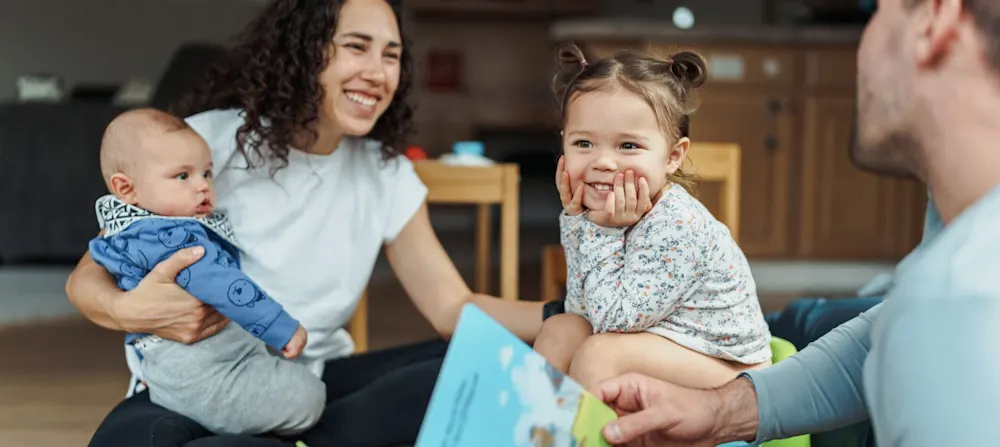 A family potty training a toddler.