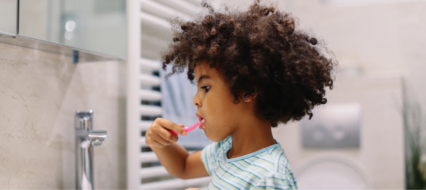 Child brushing their teeth before bed. | Huckleberry