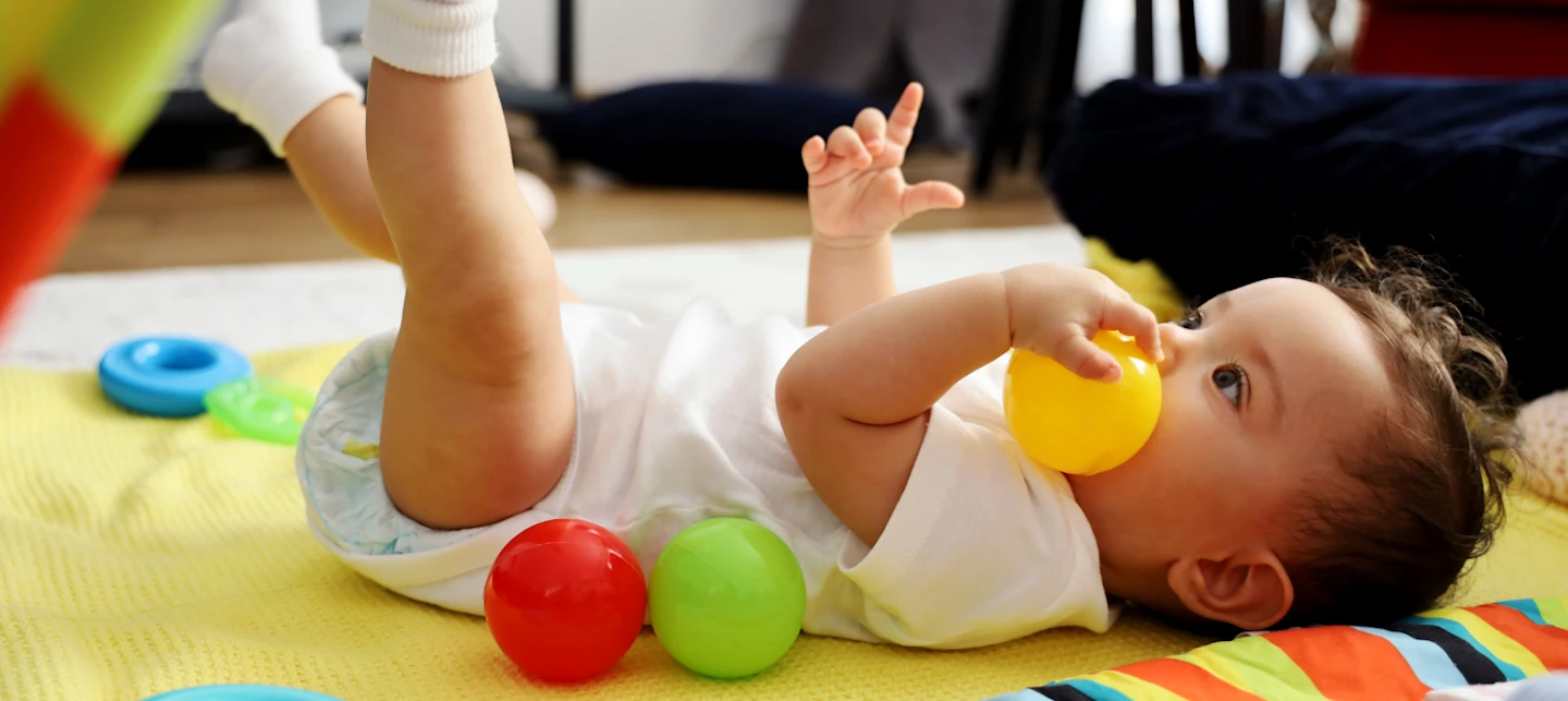 Baby doing floor time play | Huckleberry