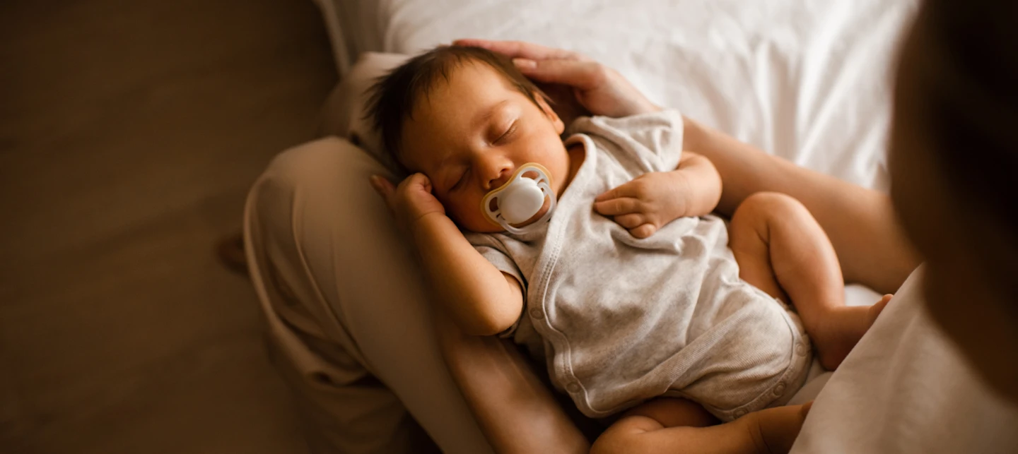 Baby asleep with a sleep consultant | Huckleberry