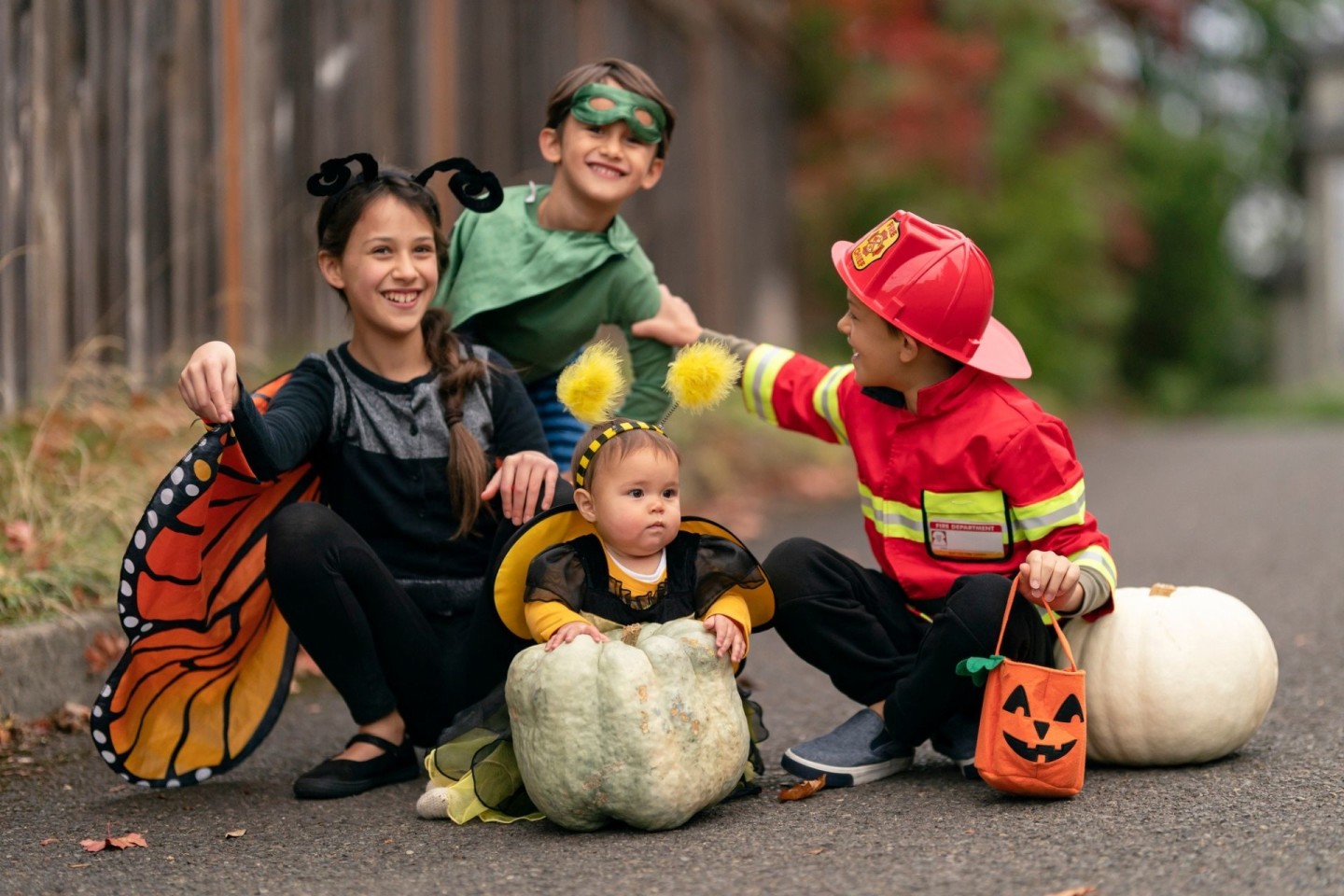 Halloween sleep tips, a group of trick or treaters celebrate Halloween in costumes