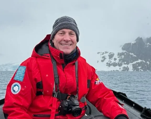 Shawn Keeton takes a boat ride to take photos during one his many trips. Shawn has more energy to make multiple trips a year since he began treating his obstructive sleep apnea with Inspire® therapy.