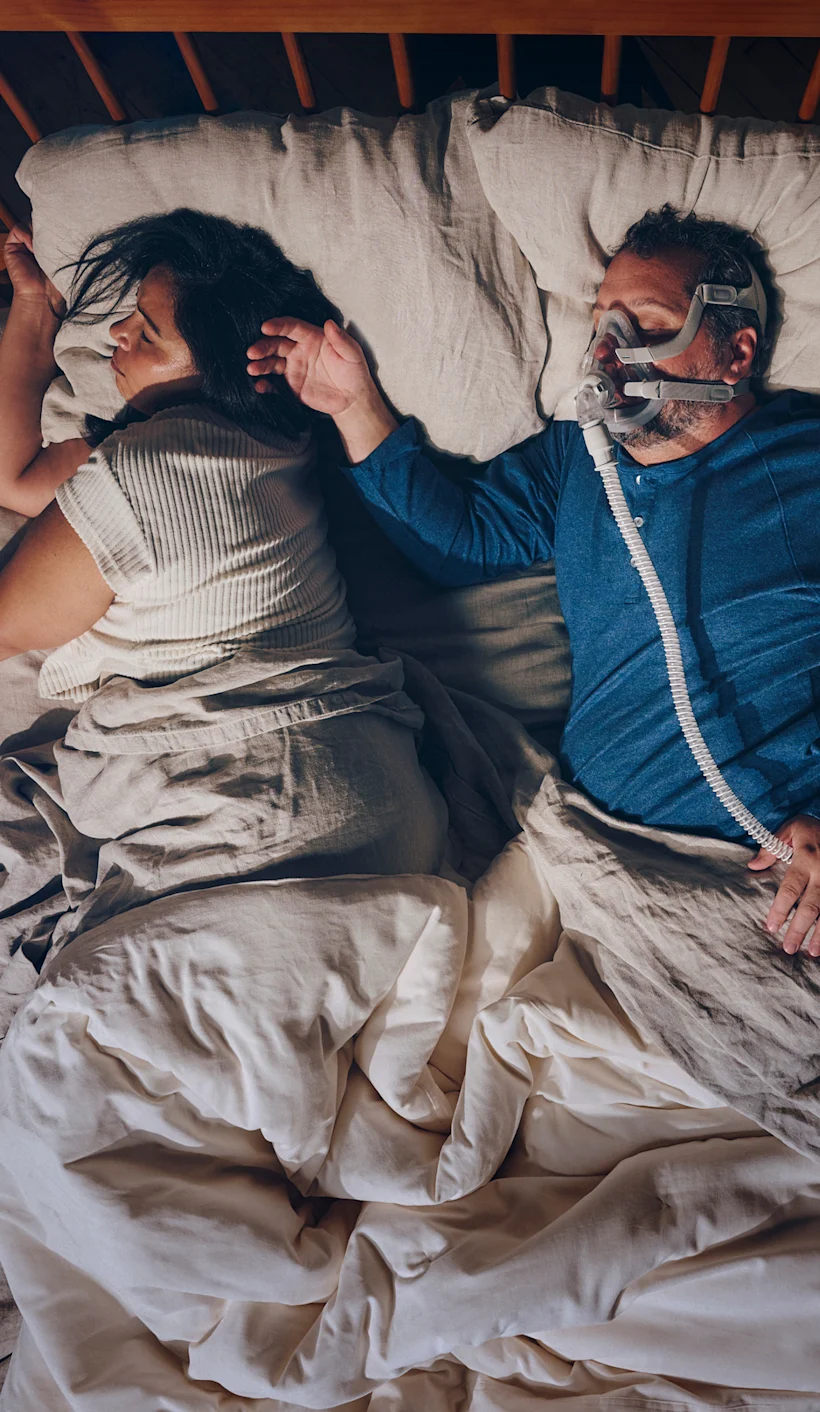 Couple with husband sleeping with CPAP - Mobile
