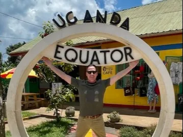 Shawn Keeton poses at the equator line in Uganda on a recent trip. Shawn enjoys traveling around the world since he started treating his obstructive sleep apnea with Inspire® therapy.