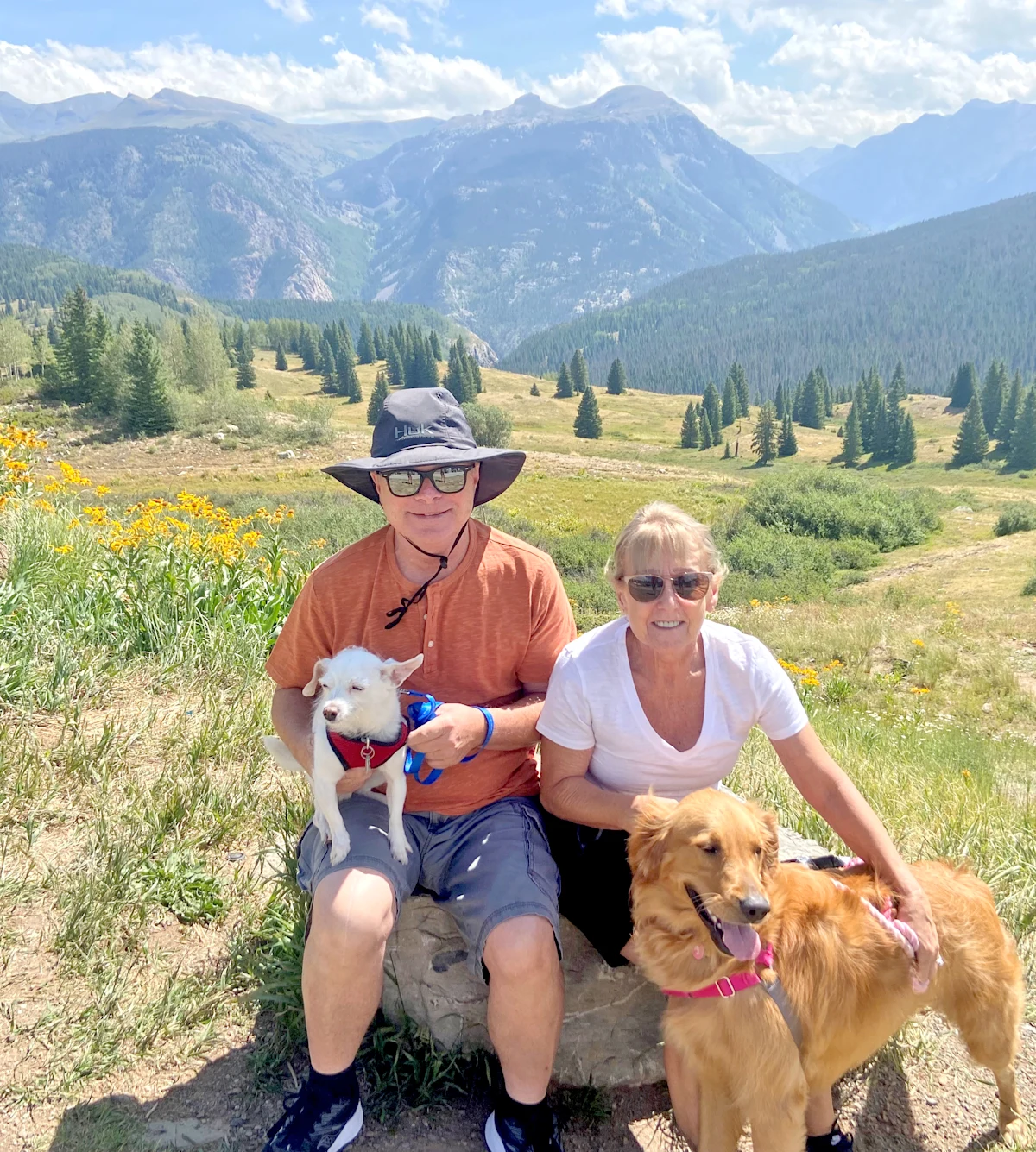 Brenda Fitzgerald and her husband Archie relax with their dogs Cali (right) and Surf after a hike in Arizona.