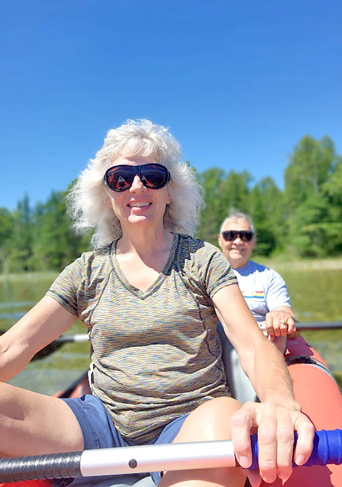 Linda Cole and her husband Mark paddle down the river.
