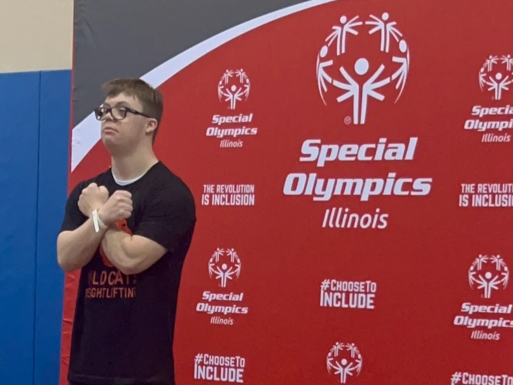Austin Cleary celebrates a gold medal in powerlifting at the Illinois Special Olympics state meet in June 2025. Austin, who has Down syndrome, has more energy to train since treating his obstructive sleep apnea with Inspire® therapy.
