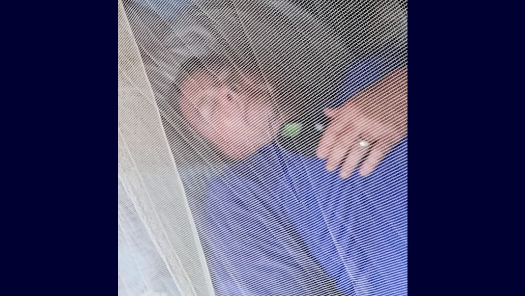 David O'Neil, who was diagnosed with severe obstructive sleep apnea, turns on Inspire® therapy before falling asleep in his tent while traveling on safari in Kenya.