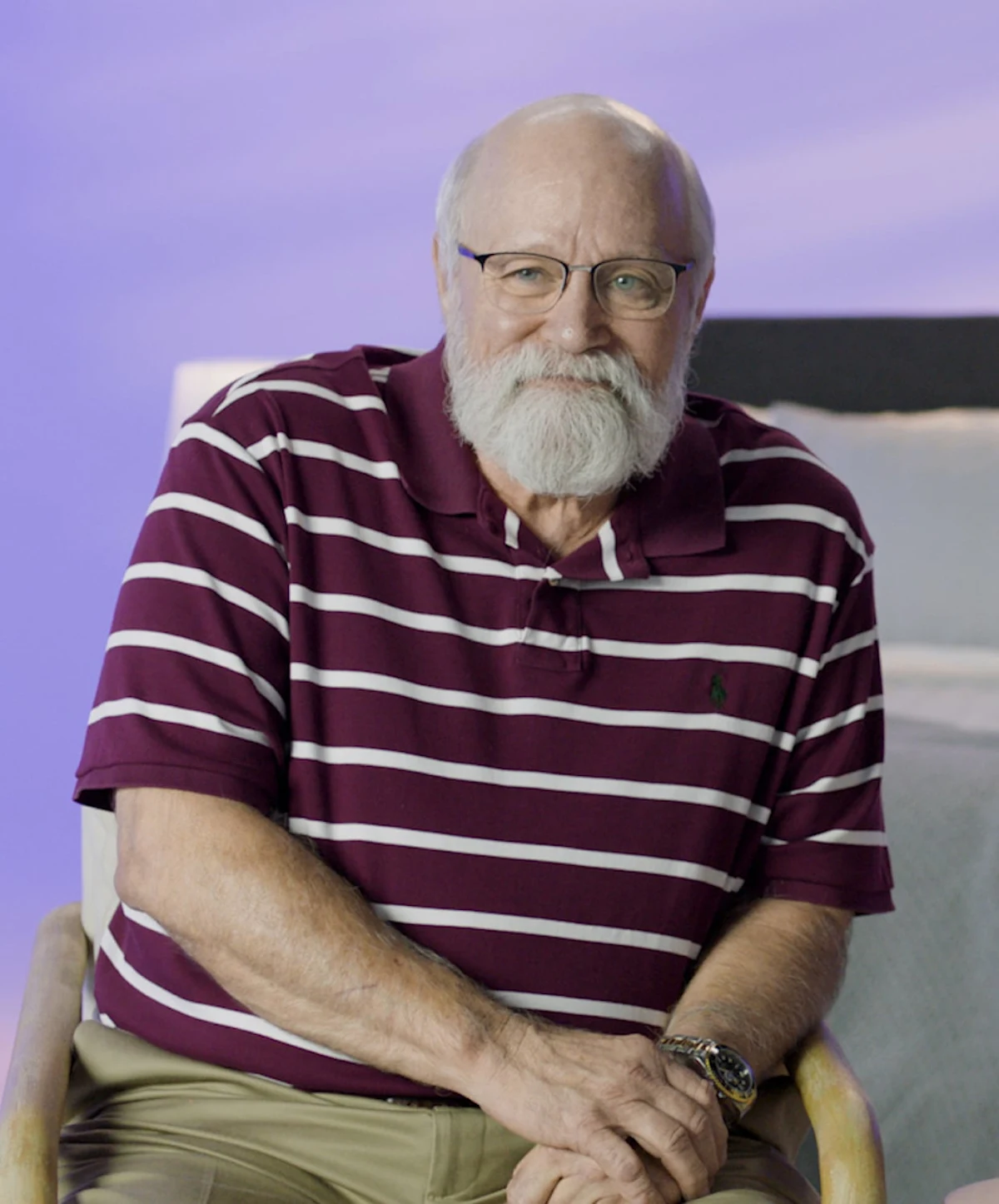 Man sitting in chair telling story