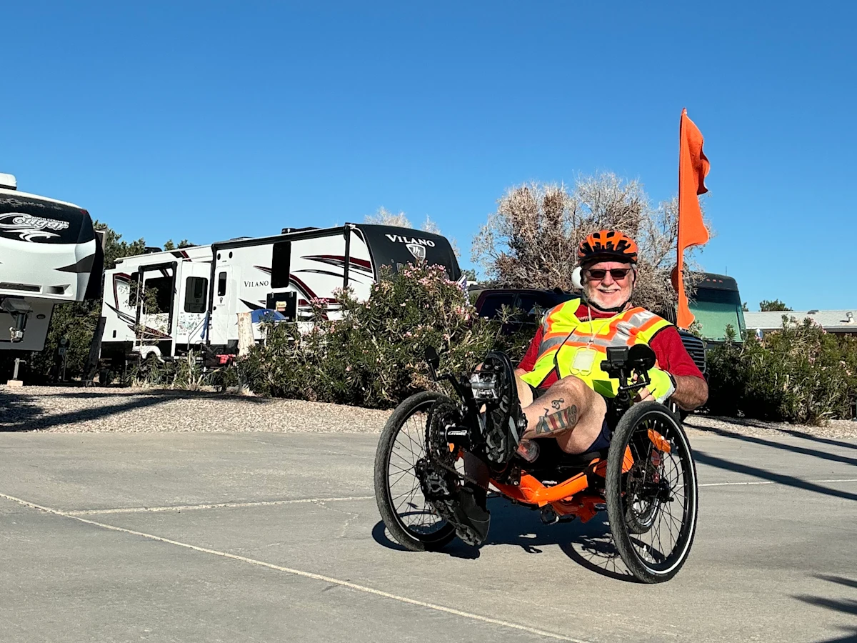 Rex Partlow bikes around an RV park with his newfound energy. Rex likes to go on bike rides with his wife more often since he started treating his obstructive sleep apnea with Inspire® therapy.