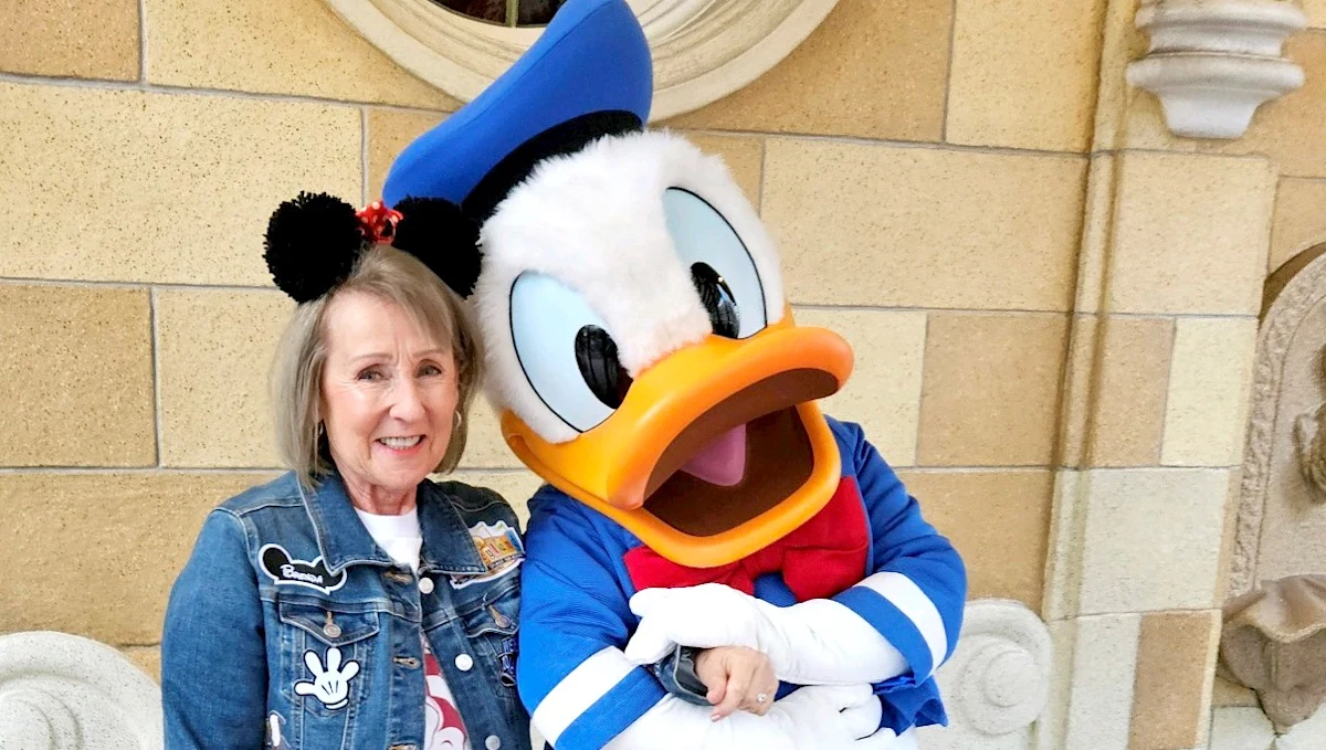 Brenda Fitzgerald poses with Daffy Duck on a vacation trip.