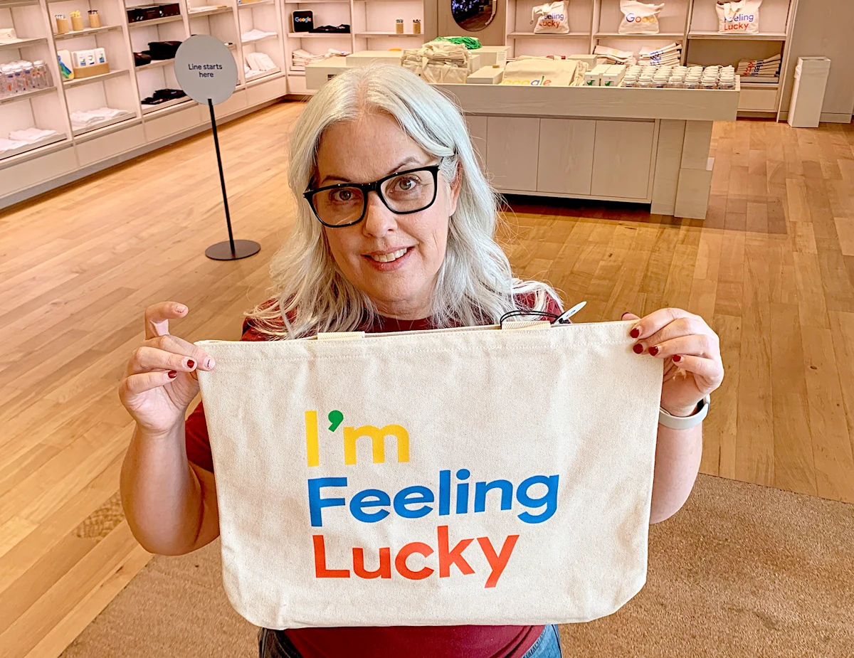 Karen Wolk holding I'm Feeling Lucky sign
