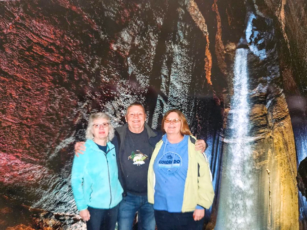 Linda Cole, her husband Mark and her friend Pat hang out by a cave waterfall. Like Linda, her friend Pat also has Inspire.