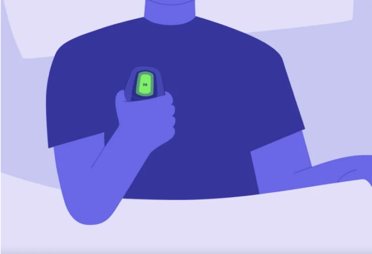 The image is a close-up illustration showing a person holding an Inspire Therapy Device.