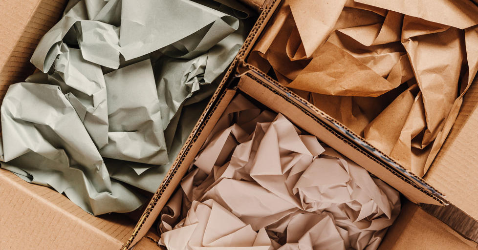 Cardboard boxes with crumpled paper inside