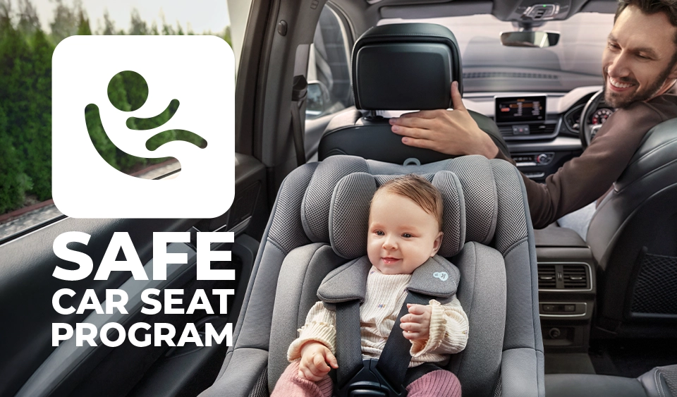 Werbung: Kinderkraft „Safe Car Seat Program“ – Kleinkind sicher im Autositz mit Logo für das Sicherheitsprogramm.