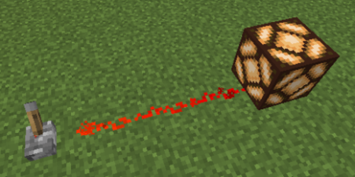 Figure 1 The power from the switch transfers through the redstone dust and turns the lamp on