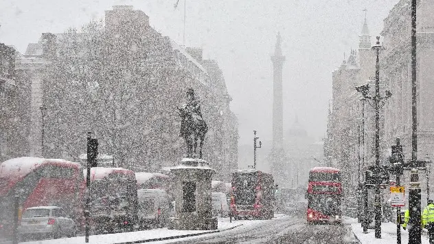 Snow falls over Westminster, London