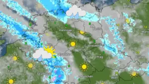 WetterRadar mit Regengebiet im Nordosten, einem trockenem Streifen von der Nordsee bis zu Bayerischen Wald und Schauerwetter im Südwesten. 