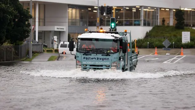 Truck drives through floodwater