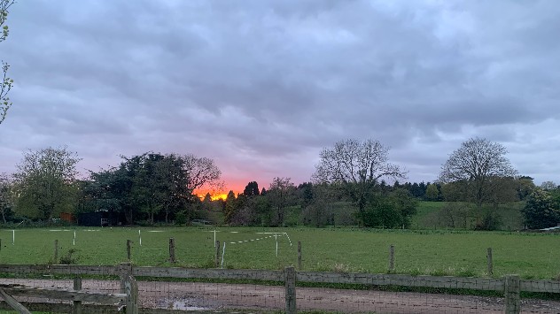 Red sunrise rising over Belbroughton village in Worcestershire