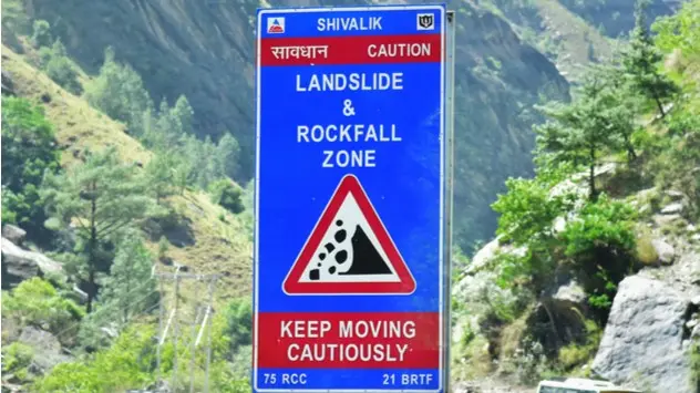 falling rock zone sign