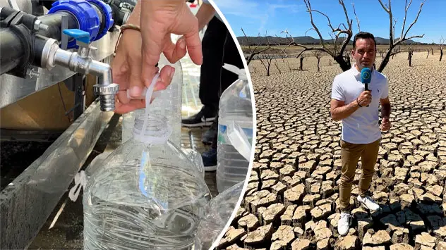 Menschen in Spanien vor einem Tankwagen mit Trinkwasser