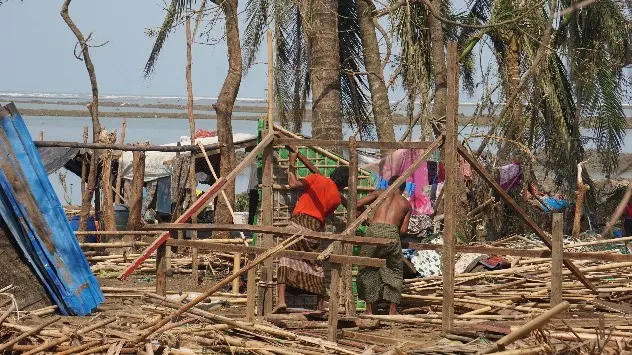 Villagers rebuild a house destroyed by Cyclone Mocha in Sittwe, Rakhine State, Myanmar