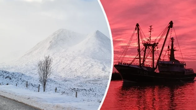 Snowy mountains on left, ship docked at sunset on right