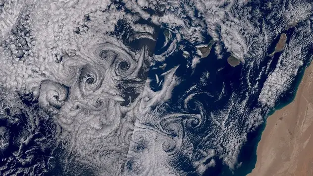 The large cloud vortices can only be seen from space. 